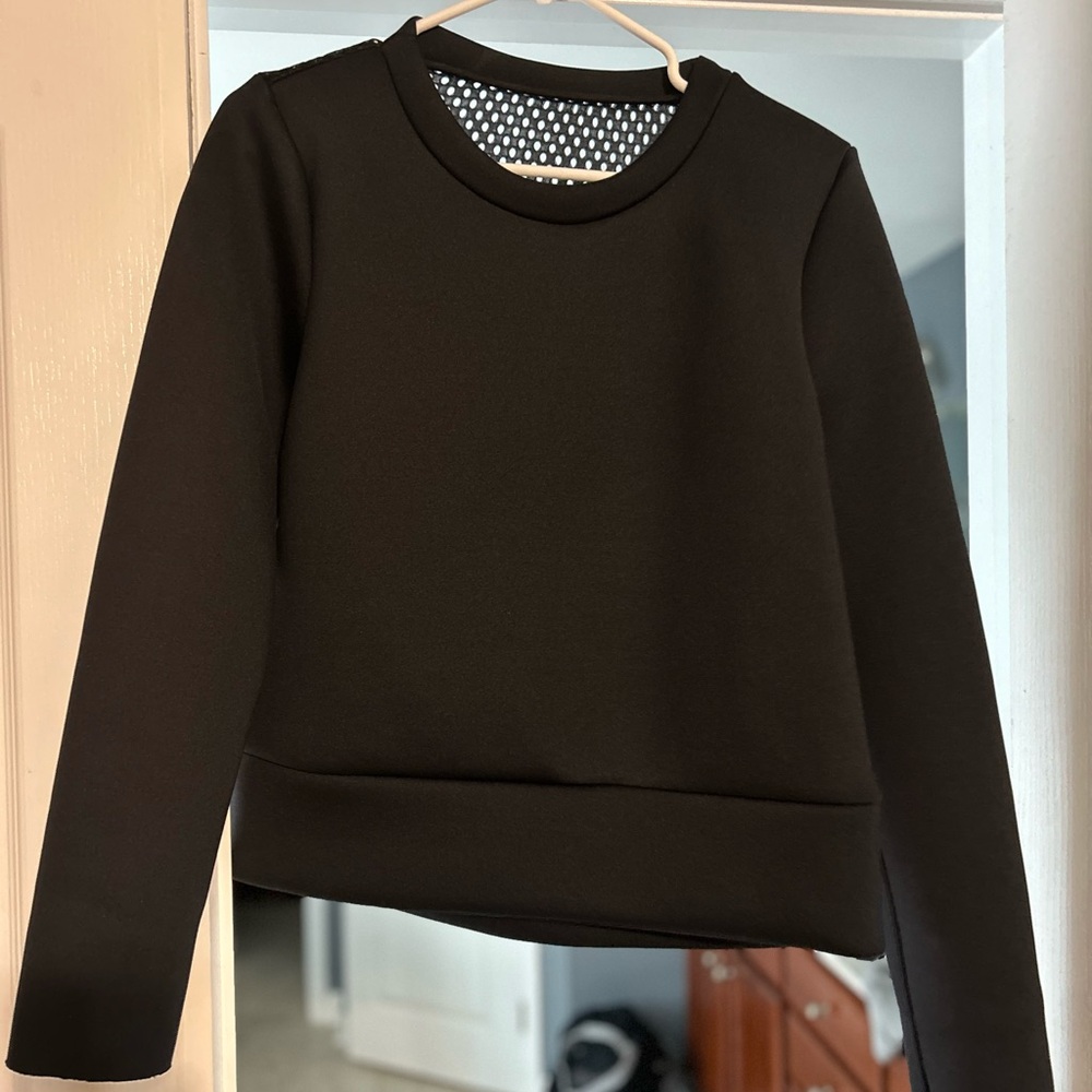 Black Sweatshirt, the back is mesh, the front is solid.